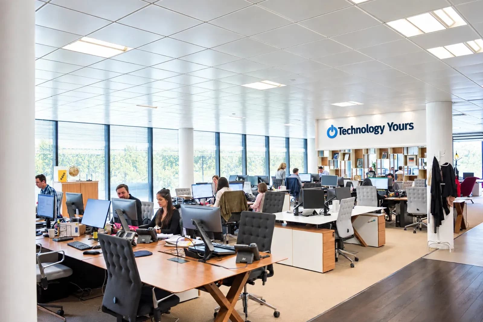 The Technology Yours open-plan office, with the company logo on the back wall